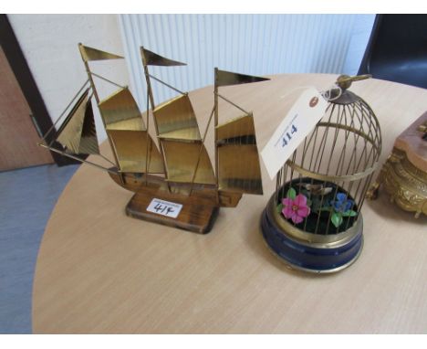  Sale Item:    MUSICAL BIRD IN CAGE & METAL SHIP  Vat Status:   No Vat   Buyers Premium:  This lot is subject to a Buyers Pre