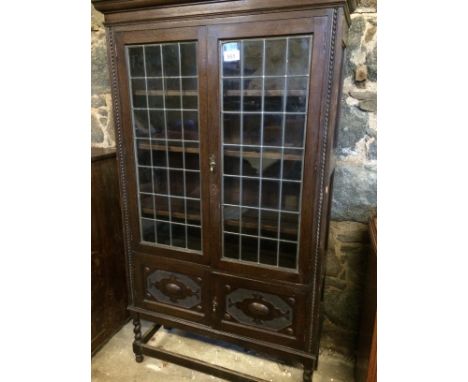  Sale Item:    OAK LEADED GLASS BOOKCASE (AF)   Vat Status:   No Vat   Buyers Premium:  This lot is subject to a Buyers Premi