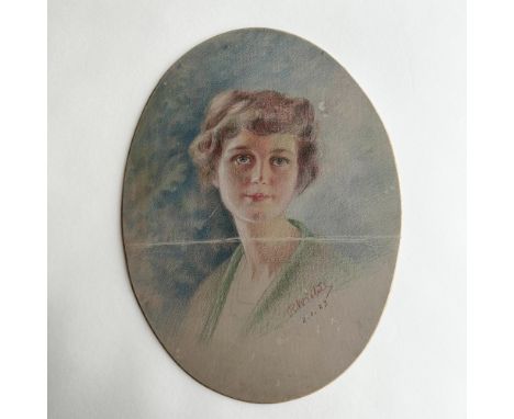Antique original pastel on an oval board featuring the portrait of a young woman that the artist drew with delicate strokes o