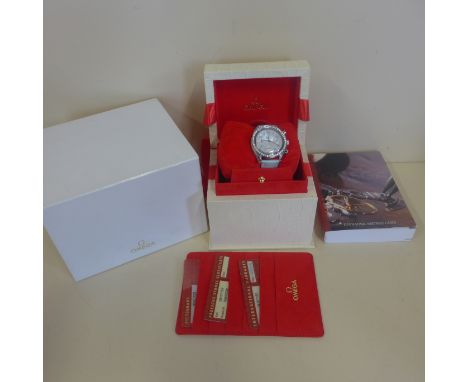 An Omega ladies 2004 Speedmaster automatic diamond set stainless steel chronometer wristwatch, with mother of pearl dial, 38m