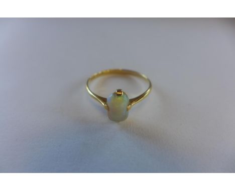 An 18ct opal ring, marked 18ct, size Q, approx 1.9 grams, in generally good condition 