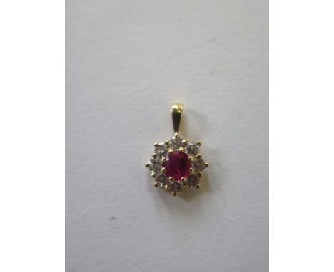 A hallmarked diamond and ruby pendant, 10mm wide, diamond approx 0.46ct, ruby approx 0.39ct - approx weight 1.3 grams, stones