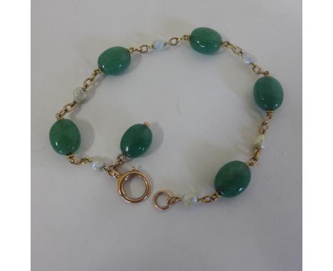A jade and pearl bracelet, 21cm long, generally good 
