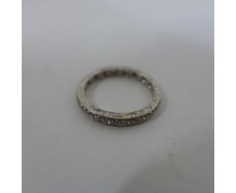 A white metal diamond full eternity ring, size K/L, approx 3 grams, in good condition 