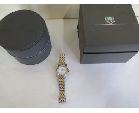 A ladies Tag Heuer Professional 200m, Tag Heuer buckle, date apperture at 3 o'clock and central seconds sweep, quartz movemen