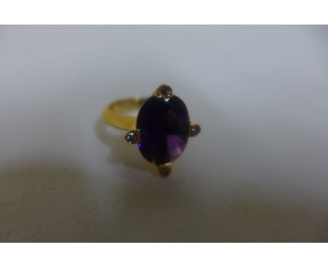 A 19ct yellow gold amethyst and diamond ring, amethyst approx 13x10mm - size L.M approx 8 grams, in good condition with 800 P