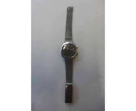 A gents Omega Chronostop stainless steel manual wind wristwatch, on an Omega bracelet strap, running, some usage marks, missi