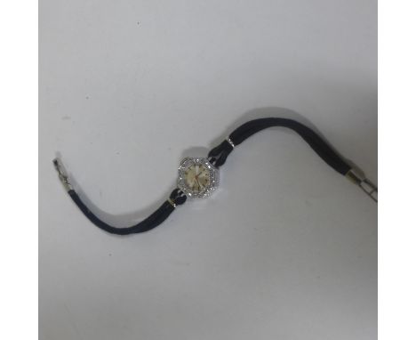 A ladies Omega platinum and diamond manual wind cocktail watch, case 17mm wide, total weight with strap approx 9.7 grams, gen