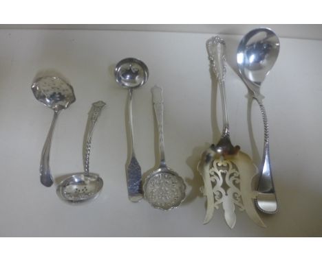 Two silver sifter spoons and a small sauce ladle, and an Art Nouveau berry spoon, Sheffield 1913 - A Dutch silver sauce ladle