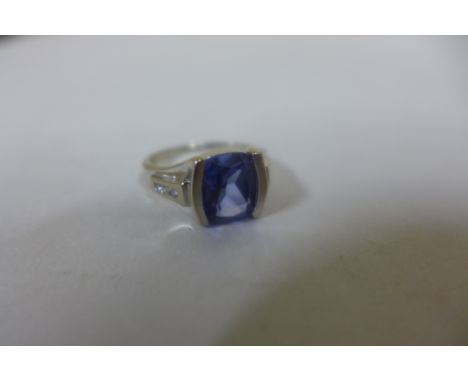 An 18ct white gold sapphire and diamond ring, the sapphire approx 9x8x4.2mm - ring size K, approx 3.5 grams, stone in good co