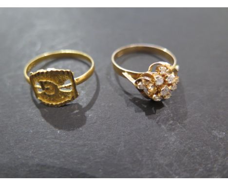 An 18ct gold and diamond ring, with one stone missing, size O - and an 18ct or above initial G ring size Q with foreign hallm