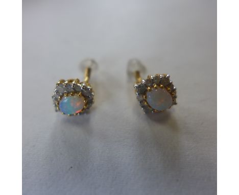 A pair of 18ct gold, opal and diamond earrings, approx 1.9 grams - in generally good condition 