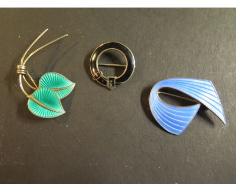 Three silver and enamel brooches, one marked 925 Norway, another signed - belt brooch has some chipping, others very clean 