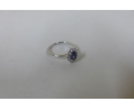 An 18ct white gold sapphire and diamond ring, size L, approx 2.6 grams, head approx 10x8mm - in good condition, marked 18K 