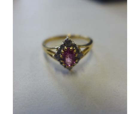 An 18ct yellow gold ruby and diamond ring, size M, approx 3.2 grams, in generally good condition 