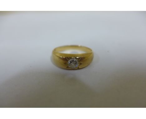 A diamond solitaire ring in a yellow gold setting, tests to 18ct, ring size N, approx 5 grams 