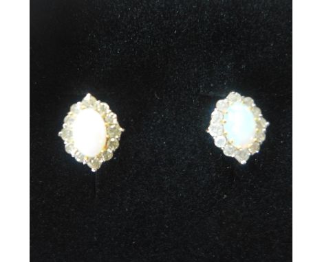 A pair of 18ct gold, opal and diamond earrings, approx 2.8 grams - in generally good condition 