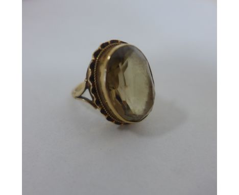 A hallmarked 9ct yellow gold citrine ring size J, head 22x16mm - approx 5.8 grams 