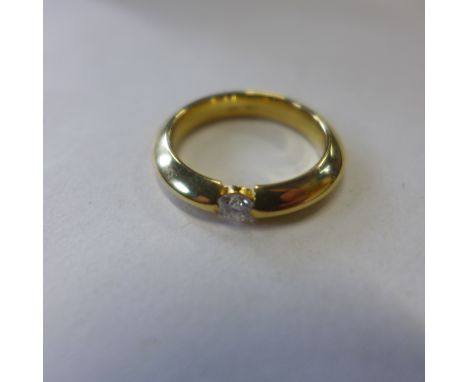 An 18ct yellow gold solitaire diamond ring, size M, approx 6.7 grams - in generally good condition 