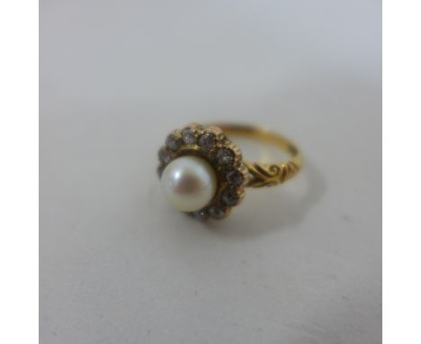 An 18ct yellow gold pearl and diamond ring, marked 18ct, size L.M, approx 4.1 grams, some usage but generally good 