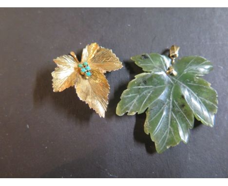 A 9ct gold and turquoise maple leaf brooch, fully hallmarked, weight 6.8 grams, length 35mm, width 30mm - and a jade maple le