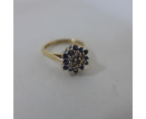 A hallmarked 9ct yellow gold diamond and sapphire cluster ring, size M, approx 2.7 grams, generally good 