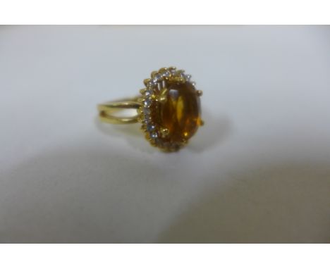 A 19ct yellow gold diamond and citrine ring, citrine size approx 11x9mm, ring size M, approx 6.7 grams, with 800 Portuguese h