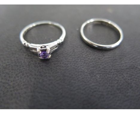 An 18ct white gold Art Deco style amethyst ring, stamped 18K size L, and an 18ct white gold wedding band, fully hallmarked, s
