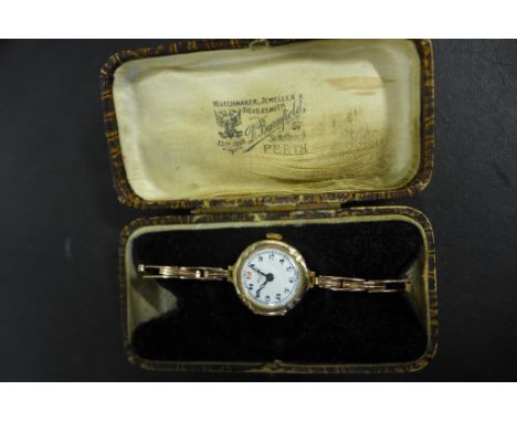 A ladies 9ct rose gold wristwatch, on expanding 9ct gold bracelet, watch and bracelet both marked 9ct, white enamel face with