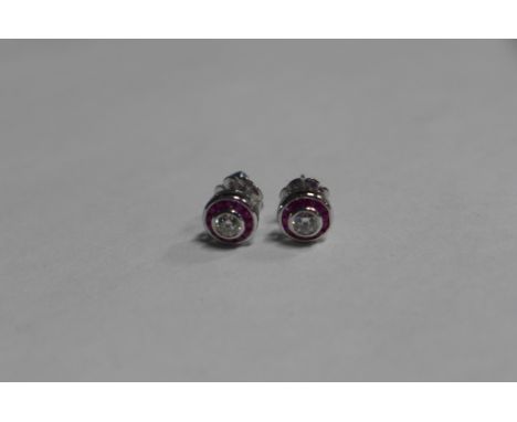 A pair of ruby and diamond earrings set in 18ct white gold, approx 2.8 grams, in good condition 