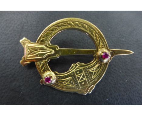 A 14ct gold Irish Celtic style brooch set with two small rubies, approx weight 8.3 grams, widest diameter 44mm, hallmarked fo