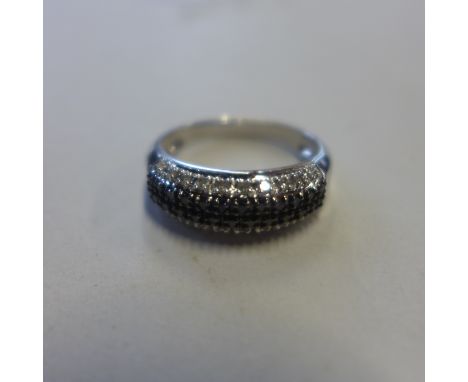 A 9ct white gold black and white diamond ring, size T, approx 4 grams, generally good 