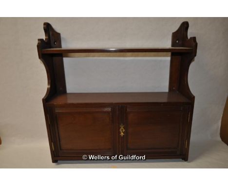 An Edwardian mahogany wall shelf.