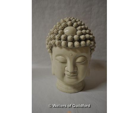 A Chinese blanc-de-chine portrait bust of a buddha with coiled hairstyle, 27cm.