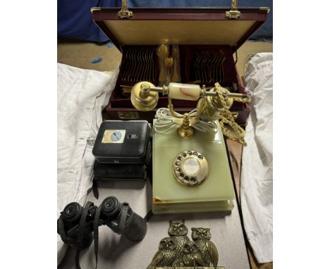 A Solingen gold plated part flatware service in a briefcase together with an onyx telephone, binoculars, cine camera etc