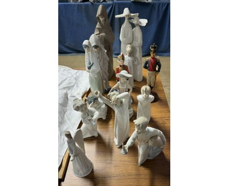 A Lladro monk together with Lladro nuns, other Lladro figures and other figures 