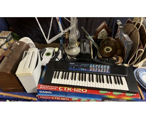 A Casio CTK-120 piano together with a Singer sewing machine, barometer, mantle clock, fur stole, cases, oil lamps,  music sta