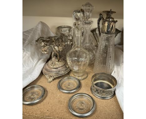An electroplated epergne together with electroplated and glass claret jugs, decanters, ice buckets, etc 