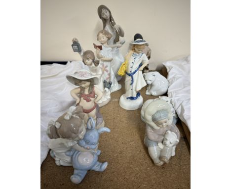 A Lladro figure of an American Indian girl and dog together with Lladro polar bears, another Lladro figure, a collection of N