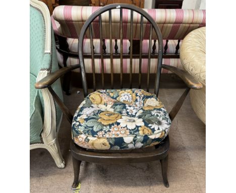 A mid 20th century Ercol elbow chair