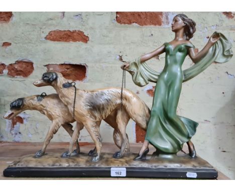 Large Art Deco lady figure walking two borzoi type dogs. There are no signs of cracks or previous repair. Paintwork to rear q