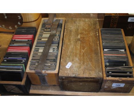 Four wooden boxes of antique glass magic lantern photographic slides, various subjects; travel, France, Italy, Belgium, archi