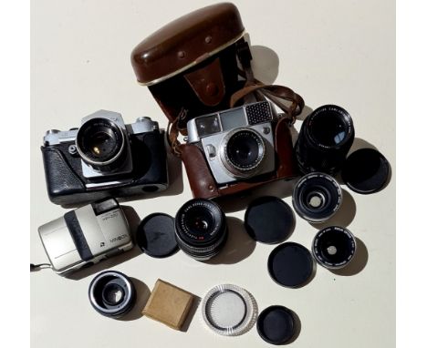 A box of vintage cameras inc. Yashica, and various lenses inc. Carl Zeiss Jena &amp; Flaktogon, etc.  