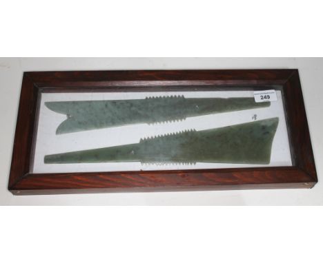 A pair of nephrite jade ceremonial axes, length 38.5cm, housed together within display case.  