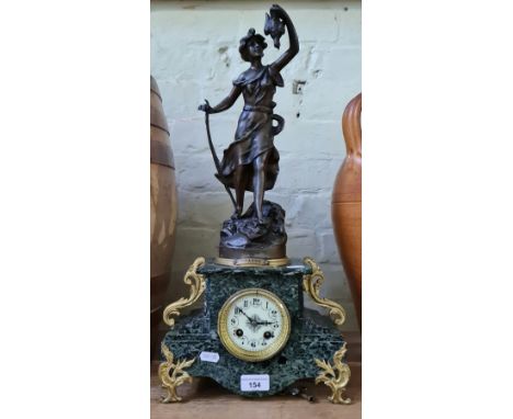 A French gilt mounted marble mantle clock with spelter figure surmount, with key.  