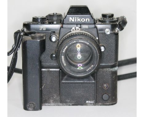 A Nikon F3 black serial no. 1484821 with Nikkor 50mm 1:1.4 lens serial no. 4437716 with Nikon Motor Drive MD-4.  Condition - 