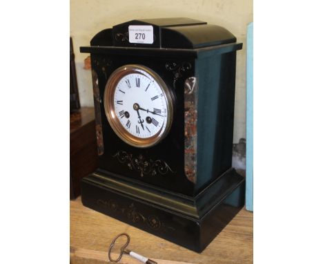 A Victorian black slate and marble architectural mantel clock.  