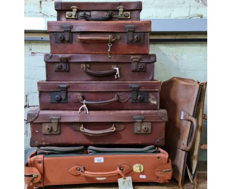 Six vintage leather cases and a leather Gladstone bag.  