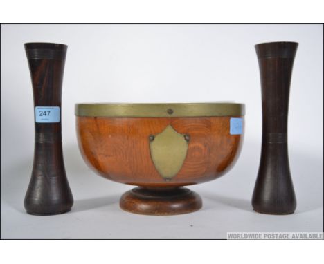 A beautiful pair of early 20th century treen worked wooden vases having ring turned collars and centre banding. Together with