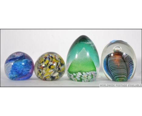 a collection of four glass paperweights to include a Caithness ' Alpine Peak ', control bubble etc please see images. Measure
